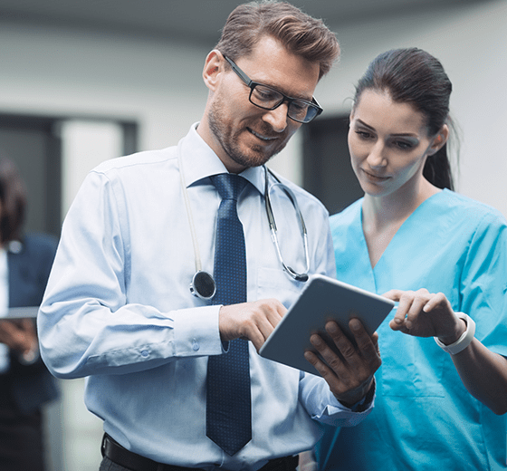 Two Healthcare Providers using Convenient Care on their device.